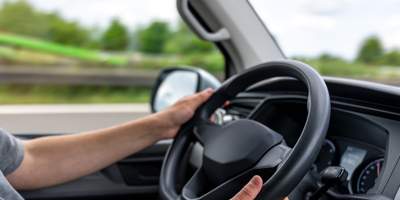 hands-steering-wheel-driver-holding-wheel-car-control-motion.jpg